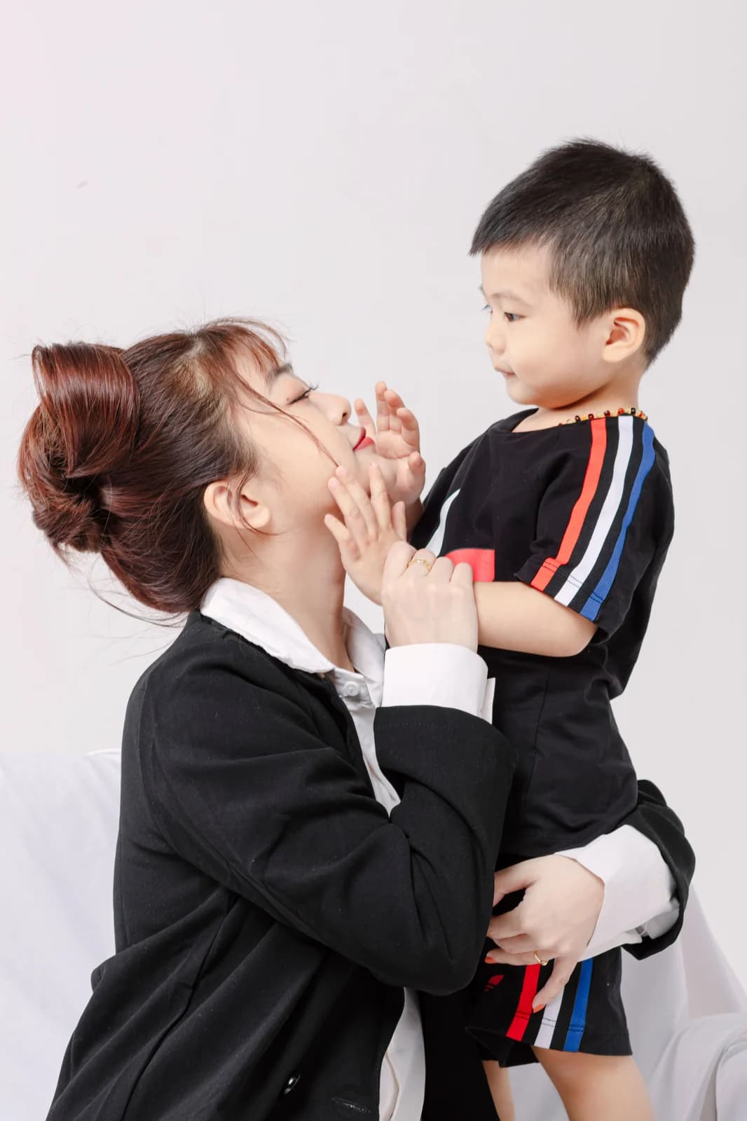 Mother holding her young son